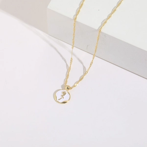 14K gold plated copper necklace featuring a white enamel round rose pendant on stone