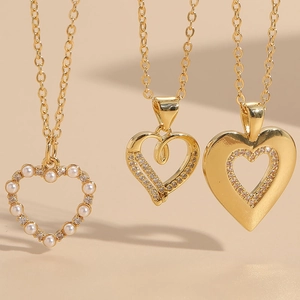 Three elegant 14K gold plated heart necklaces with pearls and sparkling zircon accents