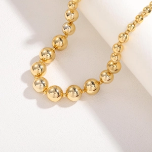 Polished 18K gold-plated titanium steel beaded necklace with mirror finish spheres