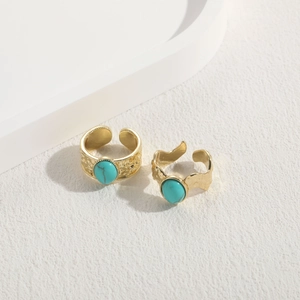Set of two gold turquoise open rings with hammered texture and wavy bohemian style design