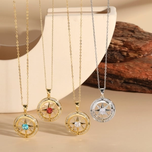 Detail of compass pendant with zircon inlay and 'I'd be lost without you' engraving