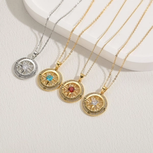 Compass pendant necklaces in 14K gold plating with zircon accents and engraved message