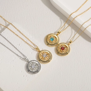 Detail view of four compass necklaces with engraved I'd be lost without you slogan