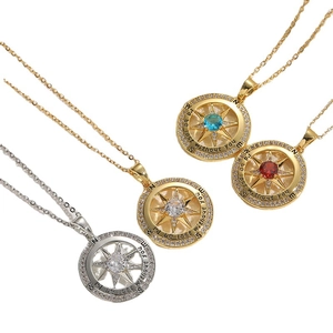 Compass pendant necklace with zircon in gold and silver finish on white background
