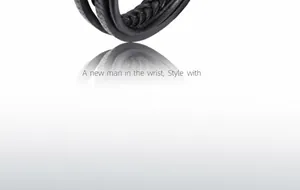 Detail view of black braided leather multi-layer bracelet with stainless steel texture