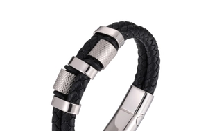 Macro view of men's black braided leather bracelet with knurled silver metal accents
