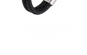 Close-up of men's braided black leather bracelet with a polished silver metal clasp