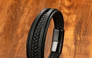 Detail of black woven microfiber leather bracelet with gunmetal magnetic clasp and texture