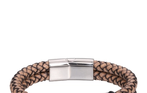Close-up of brown braided leather cord with polished silver magnetic clasp on men's bracelet