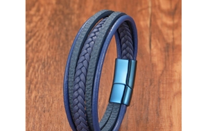 Detailed macro shot of triple-layer blue braided leather men's bracelet with magnetic clasp