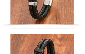 Macro shot of men's braided leather bracelet with silver and black steel clasps