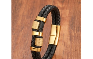 Detail of double-layer woven leather bracelet with golden knurled metal elements