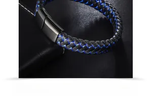 Close-up of woven black and blue microfiber leather bracelet with matte black metal clasp