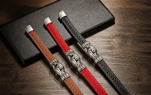 Detail showing woven leather bracelets with silver magnetic clasps in brown, red, and black