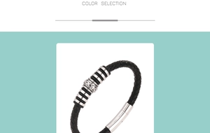 Detail of black braided leather bracelet featuring vintage silver textured charms and clasp