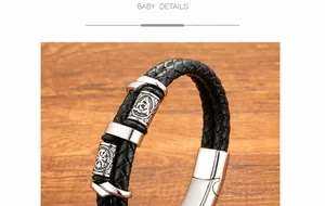 Detailed macro view of Viking totem engraving on black leather and stainless steel bracelet