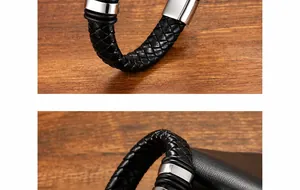 Detailaufnahme von geflochtenem schwarzem Lederarmband mit poliertem Edelstahlverschluss