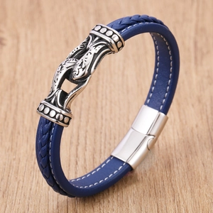 Minimalist navy braided leather bracelet with silver fish motif and stainless steel clasp