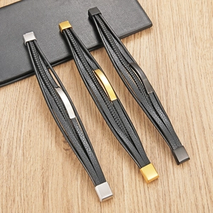 Three men's multi-layer braided leather bracelets with gold, silver and black metal clasps