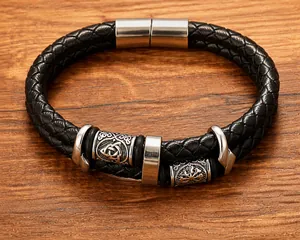 Macro shot of double-layer black leather bracelet with Nordic Viking silver beads