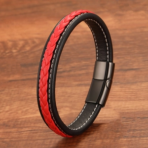 Detail of red and black braided leather bracelet with magnetic buckle and white stitching