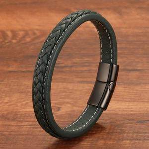 Detailed macro of dark green woven leather bracelet with matte black magnetic clasp