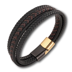 Detailed view of layered woven leather strands and a polished gold and black magnetic clasp