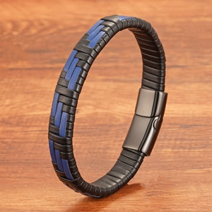 Men's multi-layer braided leather bracelet with black magnetic clasp on wood background