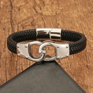 Men's punk leather bracelet featuring silver handcuff clasp with stud details