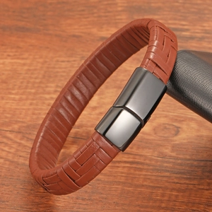 Close-up of brown woven leather bracelet featuring a magnetic stainless steel clasp
