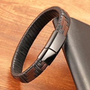 Detailed close-up of woven leather punk bracelet with black mirror metal magnetic clasp