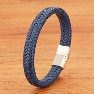 Detail of dark blue braided leather bracelet with silver magnetic metal clasp closure