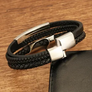 Detail of multi-layer braided black leather bracelet with polished silver metal clasp