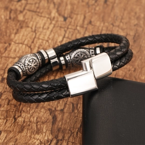 Detail of Viking Vegvisir charm on double-layer braided black leather bracelet with magnetic clasp