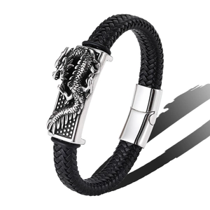 Men's vintage braided leather bracelet with silver dragon carving at 45-degree angle