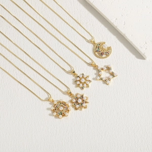 Elegant gold-tone necklaces with star, moon, and floral pendants with pearls and zircon