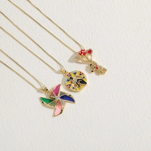 Golden necklace set with colorful enamel windmill, disc totem, and zircon bear pendants