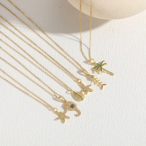 Ocean theme zircon 14K gold plated necklaces featuring starfish, shell and seahorse