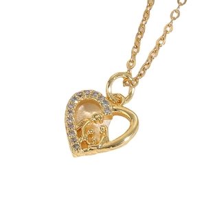Golden heart pendant necklace with shimmering zircon stones and interlocking logo design