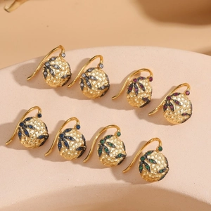 Set of four vintage gold-plated hammered ball earrings with colorful zircon leaf accents