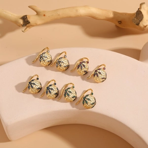 Detailed view of four pairs of vintage-style hollow spherical drop earrings with colorful zircon