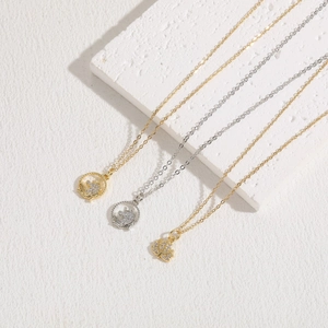 Zircon unicorn and maple leaf pendants on 14K gold plated necklaces in minimalist style