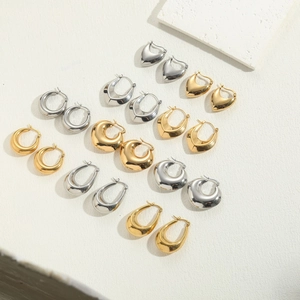 Minimalist titanium steel hoop earring set in polished gold and silver finishes