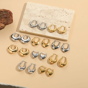 Detailed view of assorted geometric thick metal hoop earrings in gold and silver finish