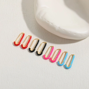 Minimalist gold safety pin earrings with colorful enamel in red, black, pink and blue