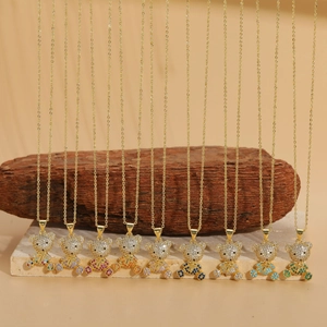 Detail view of 14K gold plated bear necklaces with colorful zircon stones inlay