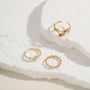 Three-piece gold plated ring set with cat-eye zircon, pearls, and star charms