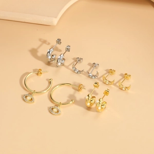 Set of five moon and evil eye earrings with opal stones in gold and silver finish
