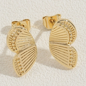 Macro shot of gold-plated butterfly stud earrings with detailed radial stripe patterns