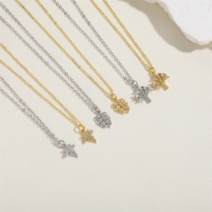 Leaf and tree pendant necklaces with cubic zirconia in 14K gold and silver plating